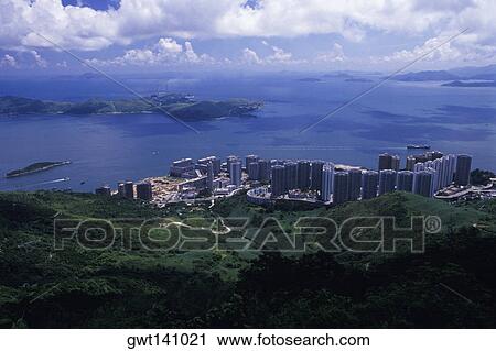 Stock Image - High angle view of city at the coast, Hong Kong, China. Fotosearch