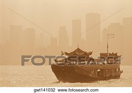 Stock Image - Houseboat in the sea, Hong Kong, China. Fotosearch