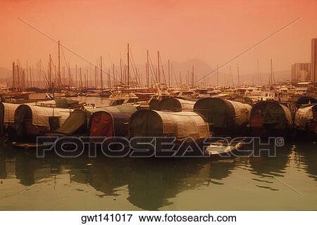 Stock Photo - Houseboats at a harbor, Hong Kong, China. Fotosearch