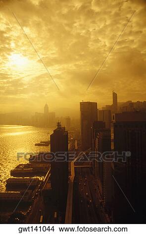 Picture - Silhouette of skyscrapers in a city, Hong Kong, China. Fotosearch