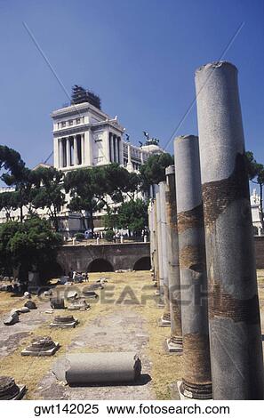 Stock Photography - Broken columns in front of a building, Italy. Fotosearch