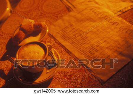 Close-up of a cup of tea with a menu on the table View Large Photo Image Stock Photography - Close-up of a cup of tea with a menu on the table. Fotosearch