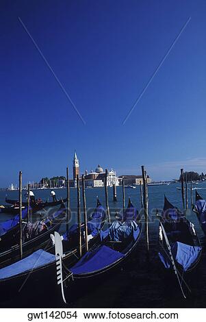 Gondolas moored in a canal, Grand Canal, Venice, Veneto, Italy View Large Photo Image Picture - Gondolas moored in a canal, Grand Canal, Venice, Veneto, Italy. Fotosearch