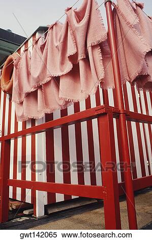 Towels hanging beside changing cubicles, Italy View Large Photo Image Stock Photography - Towels hanging beside changing cubicles, Italy. Fotosearch
