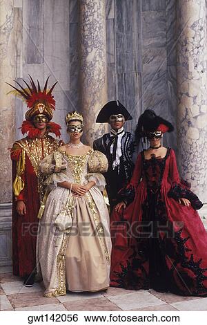 Two men and two women wearing costumes, Venice, Veneto, Italy View Large Photo Image Stock Photograph - Two men and two women wearing costumes, Venice, Veneto, Italy. Fotosearch
