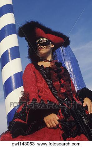 Low angle view of a young woman wearing a costume, Venice, Veneto, Italy View Large Photo Image Stock Image - Low angle view of a young woman wearing a costume, Venice, Veneto, Italy. Fotosearch