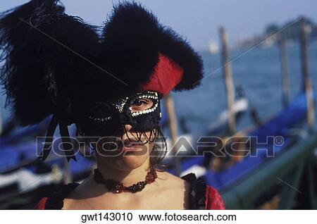Portrait of a young woman wearing carnival mask, Venice, Veneto, Italy View Large Photo Image Stock Image - Portrait of a young woman wearing carnival mask, Venice, Veneto, Italy. Fotosearch