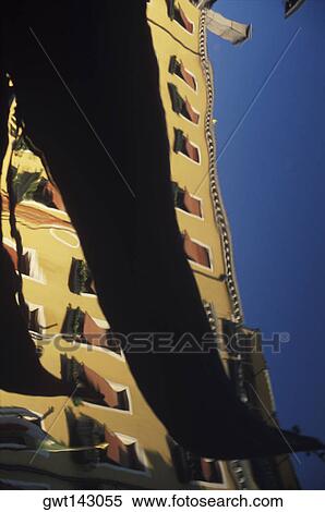 Reflection of a building and boat in water, Italy View Large Photo Image Stock Photography - Reflection of a building and boat in water, Italy. Fotosearch