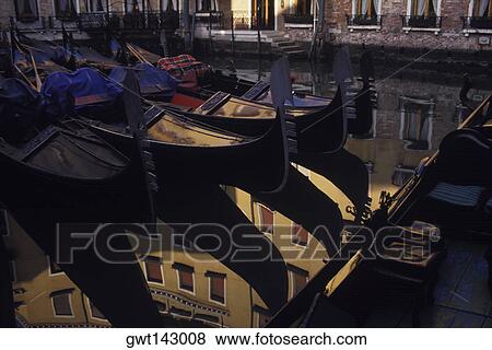 Reflection of gondolas and a building in water, Italy View Large Photo Image Stock Photo - Reflection of gondolas and a building in water, Italy. Fotosearch