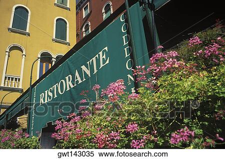 Stock Photography - Sign board in front of a building, Italy. Fotosearch