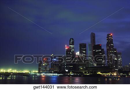 Buildings at the waterfront lit up at night, Singapore View Large Photo Image Stock Image - Buildings at the waterfront lit up at night, Singapore. Fotosearch