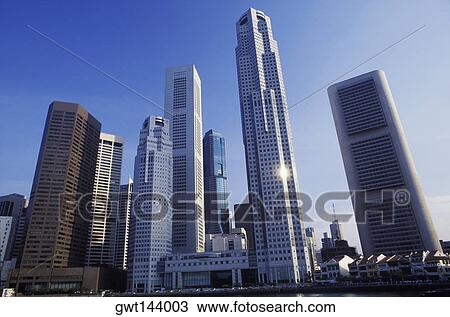 Low angle view of skyscrapers in a city, Singapore View Large Photo Image Stock Image - Low angle view of skyscrapers in a city, Singapore. Fotosearch