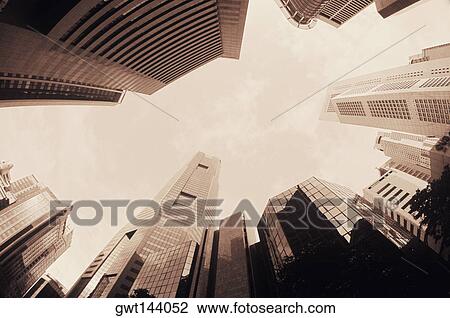 Low angle view of skyscrapers in a city, Singapore View Large Photo Image Stock Image - Low angle view of skyscrapers in a city, Singapore. Fotosearch