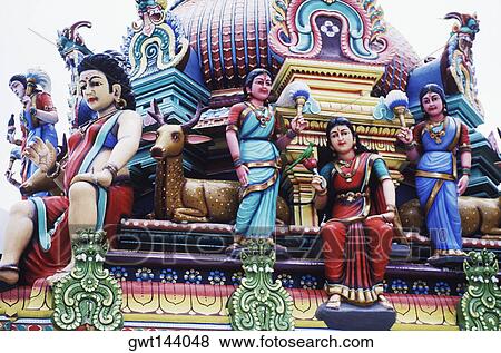 Low angle view of statues on a temple, Singapore View Large Photo Image Stock Photo - Low angle view of statues on a temple, Singapore. Fotosearch