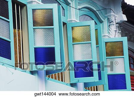 Picture - Low angle view of windows of a house, Singapore. Fotosearch