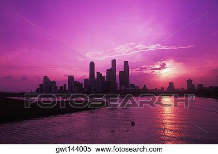 Silhouette of buildings at the waterfront, Singapore View Large Photo Image Stock Photography - Silhouette of buildings at the waterfront, Singapore. Fotosearch