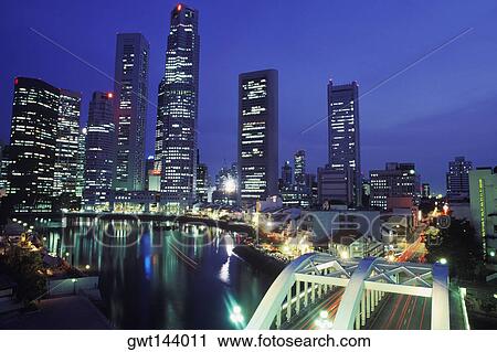 Skyscrapers lit up at night, Singapore View Large Photo Image Stock Image - Skyscrapers lit up at night, Singapore. Fotosearch