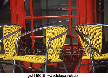 Close-up of three empty armchairs in front of a window View Large Photo Image Stock Photo - Close-up of three empty armchairs in front of a window. Fotosearch
