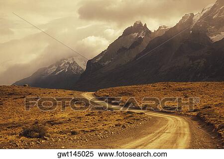 Dirt road through a landscape View Large Photo Image Stock Photography - Dirt road through a landscape. Fotosearch
