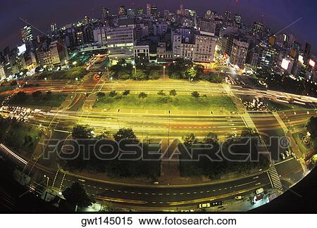 Stock Photography - High angle view of buildings lit up at night. Fotosearch