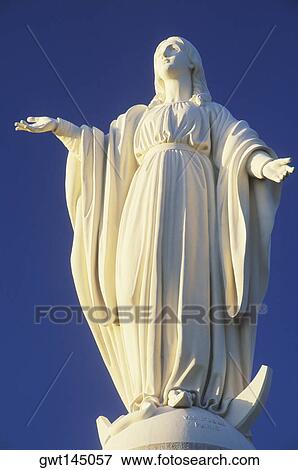 Low angle view of a statue of Virgin Mary View Large Photo Image Stock Photo - Low angle view of a statue of Virgin Mary. Fotosearch