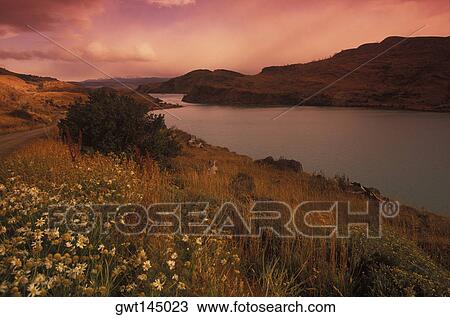 Mountain along a river View Large Photo Image Stock Image - Mountain along a river. Fotosearch