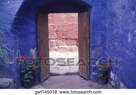 Potted plant on both sides of a door View Large Photo Image Stock Photo - Potted plant on both sides of a door. Fotosearch