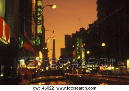 Street lights lit up at night View Large Photo Image Stock Image - Street lights lit up at night. Fotosearch