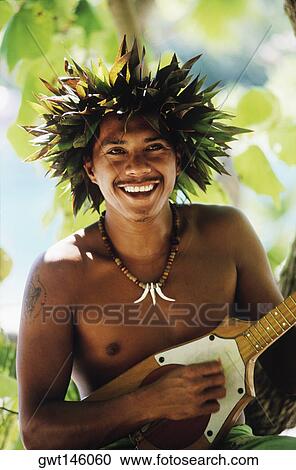 Close-up of a young man playing the ukulele, Hawaii, USA View Large Photo Image Stock Image - Close-up of a young man playing the ukulele, Hawaii, USA. Fotosearch
