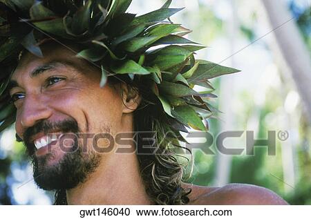Stock Image - Close-up of a young man smiling, Hawaii, USA. Fotosearch