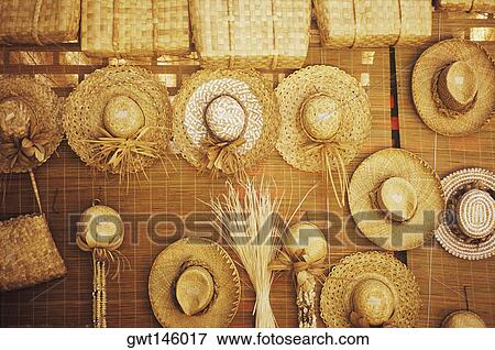 Straw hat hanging at a market stall, Hawaii, USA View Large Photo Image Stock Photo - Straw hat hanging at a market stall, Hawaii, USA. Fotosearch