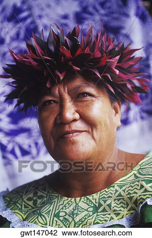 Stock Image - Close-up of a mature woman smiling, Hawaii, USA. Fotosearch