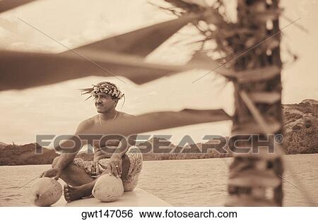 Close-up of a young man sitting on a ship's bow, Hawaii, USA View Large Photo Image Stock Photograph - Close-up of a young man sitting on a ship's bow, Hawaii, USA. Fotosearch