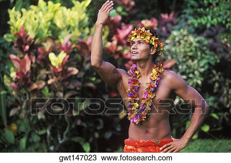 Stock Image - Close-up of a young man wearing a garland, Hawaii, USA. Fotosearch