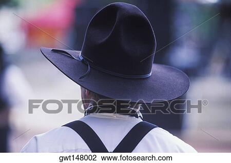 Rear view of a man wearing a cowboy hat View Large Photo Image Stock Image - Rear view of a man wearing a cowboy hat. Fotosearch