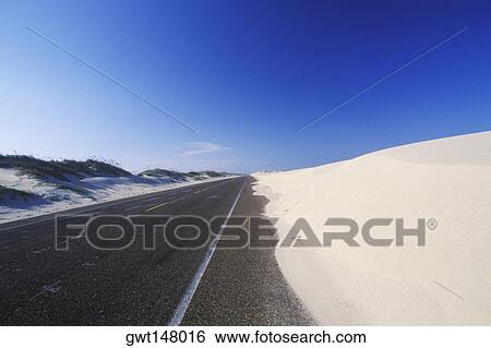 Road passing through a snow covered landscape, Texas, USA View Large Photo Image Stock Photograph - Road passing through a snow covered landscape, Texas, USA. Fotosearch