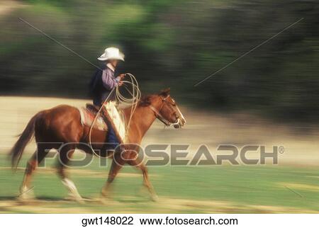 Side profile of a cowboy riding a horse, Texas, USA View Large Photo Image Stock Image - Side profile of a cowboy riding a horse, Texas, USA. Fotosearch