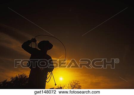 Silhouette of a cowboy View Large Photo Image Stock Image - Silhouette of a cowboy. Fotosearch