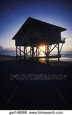 Silhouette of a lifeguard hut on the beach, Texas, USA View Large Photo Image Stock Photo - Silhouette of a lifeguard hut on the beach, Texas, USA. Fotosearch