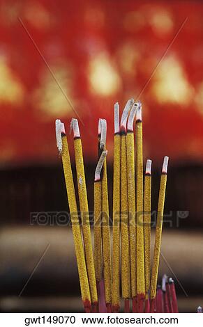 Close-up of incense sticks burning View Large Photo Image Stock Image - Close-up of incense sticks burning. Fotosearch