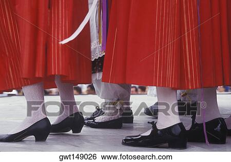 Stock Photograph - Low section view of a group of women standing. Fotosearch
