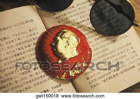 Close-up of a paperweight and sunglasses on an open book View Large Photo Image Stock Photo - Close-up of a paperweight and sunglasses on an open book. Fotosearch