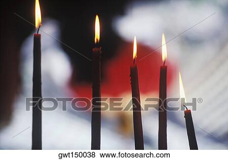 Close-up of lit candles View Large Photo Image Stock Photo - Close-up of lit candles. Fotosearch