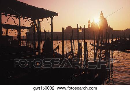 Gondolas moored at a dock View Large Photo Image Stock Image - Gondolas moored at a dock. Fotosearch