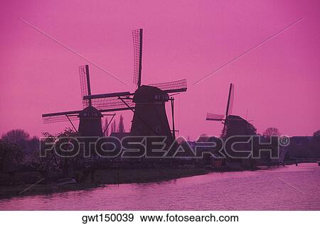 Traditional windmill at the waterfront View Large Photo Image Stock Photo - Traditional windmill at the waterfront. Fotosearch