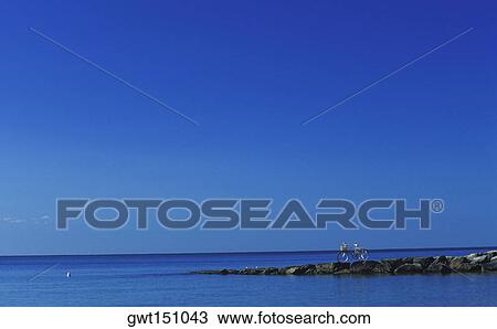 Bicycle parked on a jetty View Large Photo Image Stock Image - Bicycle parked on a jetty. Fotosearch