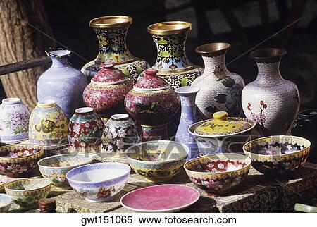 Close-up of jars with bowls and a plate in a store View Large Photo Image Stock Photography - Close-up of jars with bowls and a plate in a store. Fotosearch