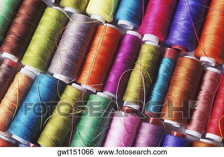 Close-up of spools of thread View Large Photo Image Stock Photograph - Close-up of spools of thread. Fotosearch