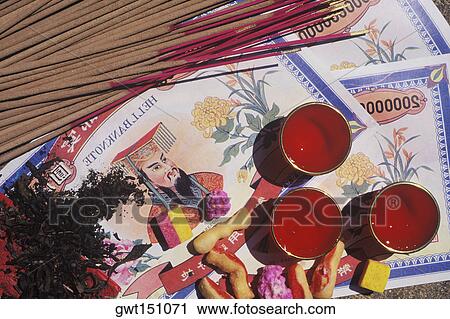 High angle view of incense sticks with bank notes and candles View Large Photo Image Stock Image - High angle view of incense sticks with bank notes and candles. Fotosearch