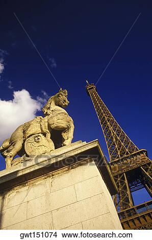 Statue in front of a tower, Eiffel Tower, Paris, France View Large Photo Image Picture - Statue in front of a tower, Eiffel Tower, Paris, France. Fotosearch